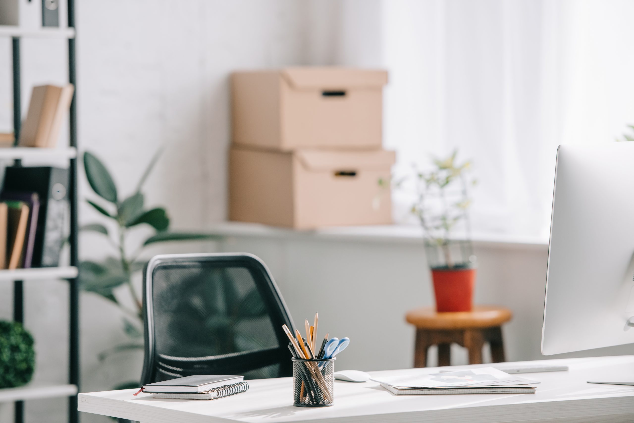 office supplies and computer on table in business office