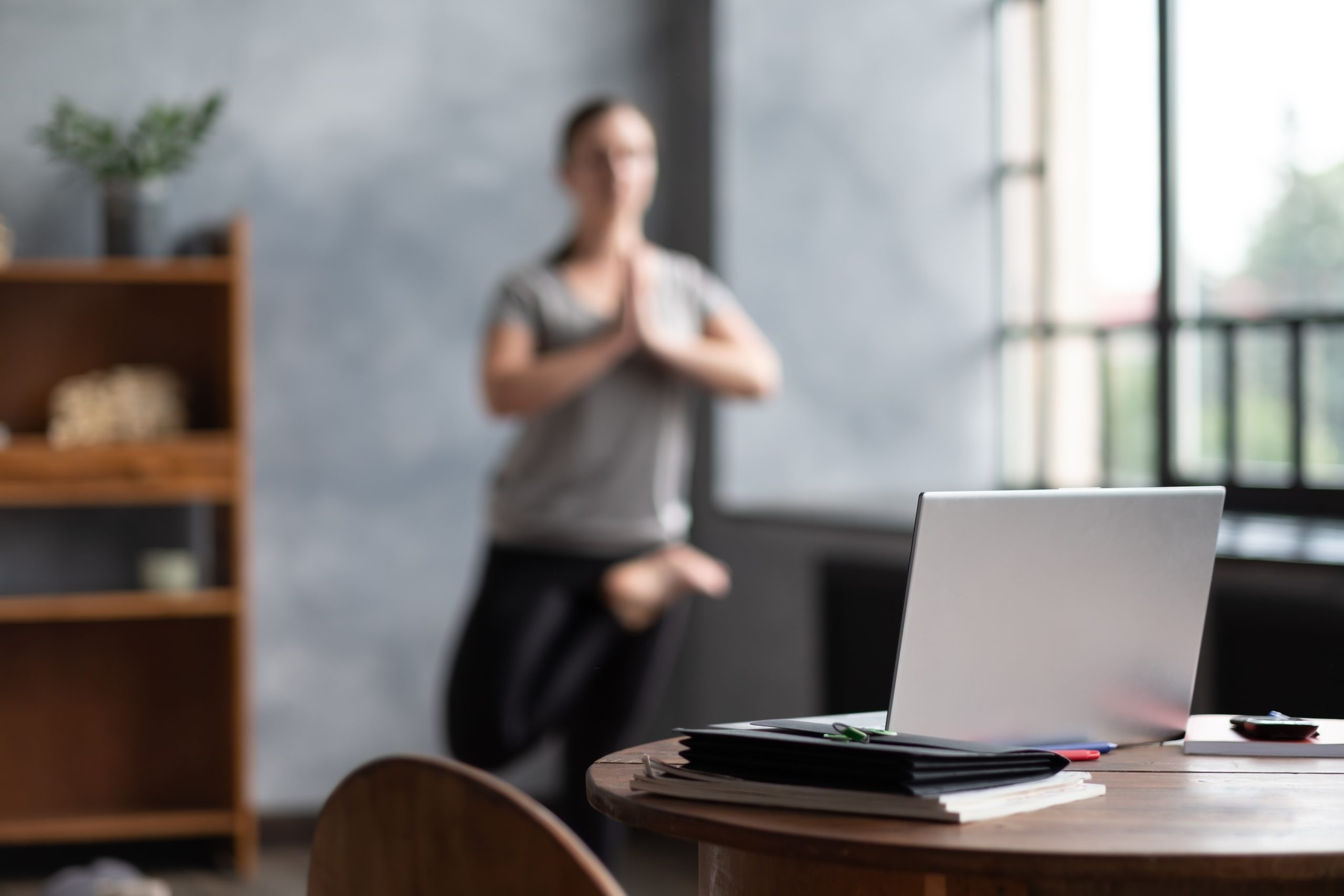 Blurred photo caucasian woman working yoga exercise doing balance exercise.